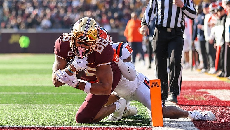 Nov 4, 2023; Minneapolis, Minnesota, USA; Minnesota Golden Gophers tight end Brevyn Spann-Ford (88) dives for a touchdown while Illinois Fighting Illini defensive back Miles Scott (10) defends during the first half at Huntington Bank Stadium. Mandatory Credit: Matt Krohn-USA TODAY Sports
