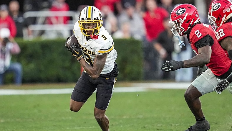 Nov 4, 2023; Athens, Georgia, USA; Missouri Tigers wide receiver Luther Burden III (3) runs against Georgia Bulldogs linebacker Smael Mondon Jr. (2) and defensive back Javon Bullard (22) during the second half at Sanford Stadium. Mandatory Credit: Dale Zanine-USA TODAY Sports