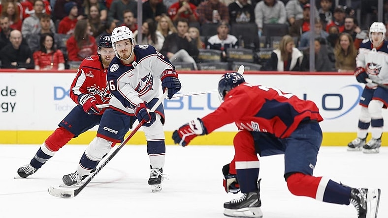 Nov 4, 2023; Washington, District of Columbia, USA; Columbus Blue Jackets center Jack Roslovic (96) skates with the puck as Washington Capitals right wing Anthony Mantha (39) and Capitals center Connor McMichael (24) defend in the first period at Capital One Arena. Mandatory Credit: Geoff Burke-USA TODAY Sports