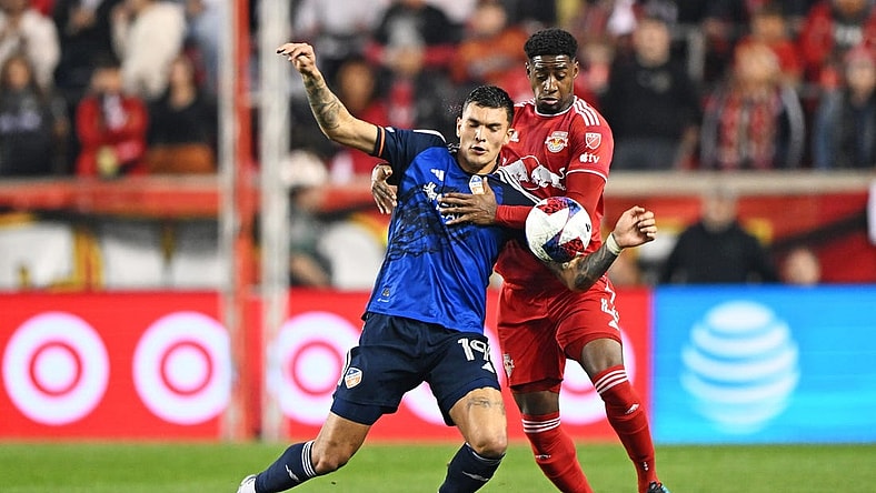 Nov 4, 2023; Harrison, NJ, USA; FC Cincinnati forward Brandon V  zquez (19) and New York Red Bulls defender Andr  s Reyes (4) battle for the ball during the first half of game two in a round one match of the 2023 MLS Cup Playoffs at Red Bull Arena. Mandatory Credit: Mark Smith-USA TODAY Sports