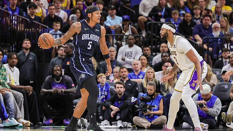 Nov 4, 2023; Orlando, Florida, USA; Orlando Magic forward Paolo Banchero (5) looks to pass against Los Angeles Lakers forward Anthony Davis (3) during the first quarter at Amway Center. Mandatory Credit: Mike Watters-USA TODAY Sports