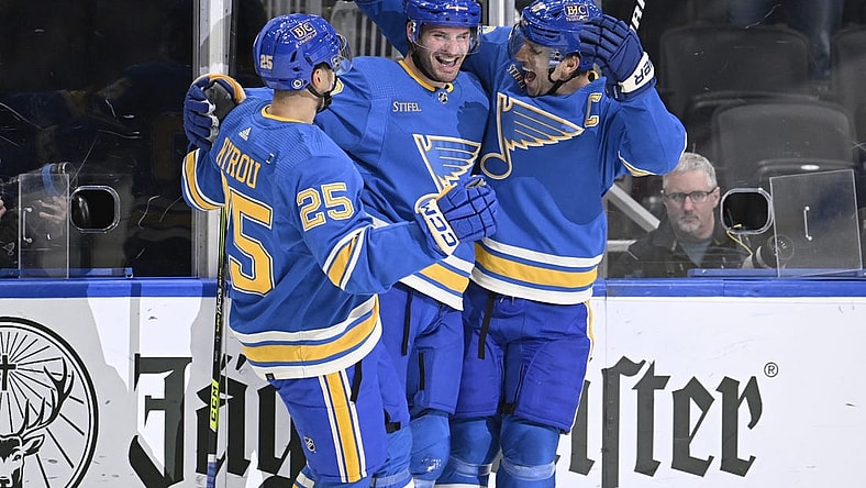 Nov 4, 2023; St. Louis, Missouri, USA; St. Louis Blues left wing Brandon Saad (20) celebrates with center Brayden Schenn (10) and St. Louis Blues center Jordan Kyrou (25) after scoring a goal against the Montreal Canadiens during the second period at Enterprise Center. Mandatory Credit: Jeff Le-USA TODAY Sports