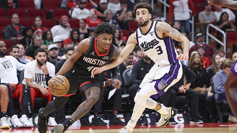 Nov 4, 2023; Houston, Texas, USA; Houston Rockets guard Jalen Green (4) drives with the ball as Sacramento Kings guard Chris Duarte (3) defends during the first quarter at Toyota Center. Mandatory Credit: Troy Taormina-USA TODAY Sports