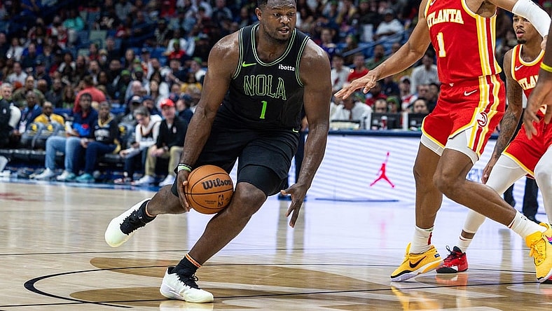 Nov 4, 2023; New Orleans, Louisiana, USA;  New Orleans Pelicans forward Zion Williamson (1) dribbles against Atlanta Hawks forward Jalen Johnson (1) during the second half at Smoothie King Center. Mandatory Credit: Stephen Lew-USA TODAY Sports