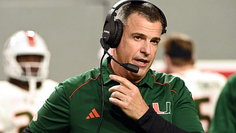Nov 4, 2023; Raleigh, North Carolina, USA; Miami Hurricanes head coach Mario Cristobal looks on during the first half against the North Carolina State Wolfpack at Carter-Finley Stadium. Mandatory Credit: Rob Kinnan-USA TODAY Sports