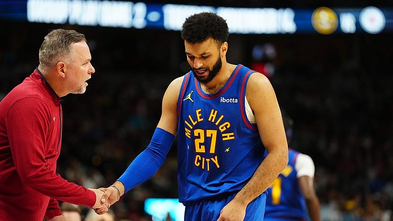 Nov 4, 2023; Denver, Colorado, USA; Denver Nuggets head coach Michael Malone checks on guard Jamal Murray (27) in the second quarter against the Chicago Bulls at Ball Arena. Mandatory Credit: Ron Chenoy-USA TODAY Sports