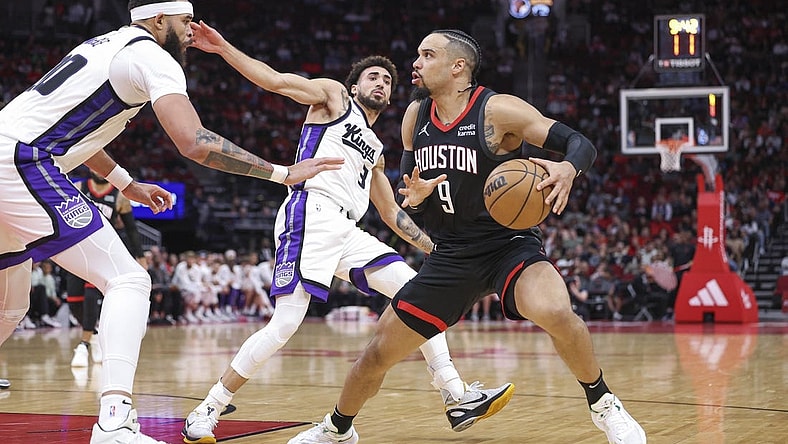 Nov 4, 2023; Houston, Texas, USA; Houston Rockets forward Dillon Brooks (9) steps back to shoot the ball as Sacramento Kings center JaVale McGee (00) defends during the second quarter at Toyota Center. Mandatory Credit: Troy Taormina-USA TODAY Sports