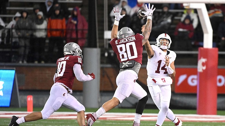 Nov 4, 2023; Pullman, Washington, USA; Stanford Cardinal quarterback Ashton Daniels (14) throws a pass against Washington State Cougars defensive end Brennan Jackson (80) in the first half at Gesa Field at Martin Stadium. Mandatory Credit: James Snook-USA TODAY Sports