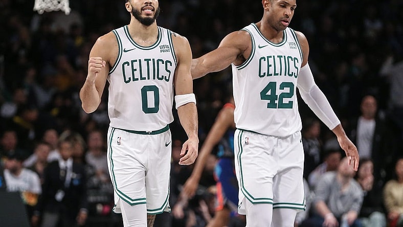 Nov 4, 2023; Brooklyn, New York, USA;  Boston Celtics forward Jayson Tatum (0) and center Al Horford (42) walk back to the bench after the Brooklyn Nets call a time out in the fourth quarter at Barclays Center. Mandatory Credit: Wendell Cruz-USA TODAY Sports