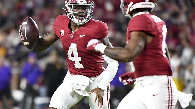 Nov 4, 2023; Tuscaloosa, Alabama, USA;  Alabama Crimson Tide quarterback Jalen Milroe (4) runs for a touchdown against LSU at Bryant-Denny Stadium. Alabama defeated LSU 42-28. Mandatory Credit: Gary Cosby Jr.-USA TODAY Sports