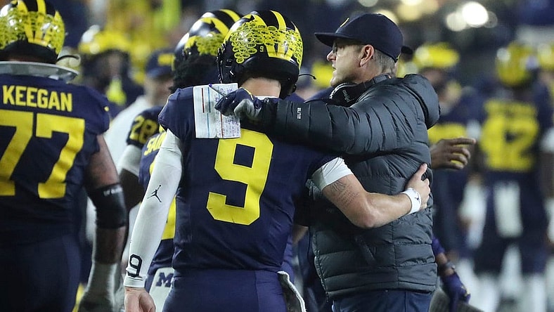 Michigan coach Jim Harbaugh meets quarterback J.J. McCarthy after a touchdown against Purdue during the second half of Michigan's 41-13 win on Saturday, Nov 4, 2023, in Ann Arbor.