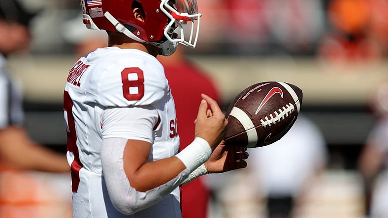 Oklahoma's Dillon Gabriel (8) warms up before a Bedlam college football game between the Oklahoma State University Cowboys (OSU) and the University of Oklahoma Sooners (OU) at Boone Pickens Stadium in Stillwater, Okla., Saturday, Nov. 4, 2023.
