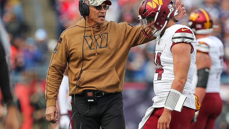 Nov 5, 2023; Foxborough, Massachusetts, USA; Washington Commanders head coach Ron Rivera talks to Washington Commanders quarterback Sam Howell (14) after an interception during the first half against the New England Patriots at Gillette Stadium. Mandatory Credit: Paul Rutherford-USA TODAY Sports
