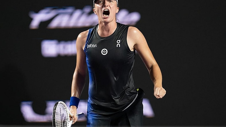 Nov 5, 2023; Cancun, Mexico; Iga Swiatek (POL) celebrates winning her match against Aryna Sabalenka (BLR) on day eight of the GNP Saguaros WTA Finals Cancun. Mandatory Credit: Susan Mullane-USA TODAY Sports