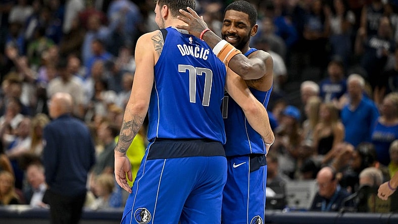 Nov 5, 2023; Dallas, Texas, USA; Dallas Mavericks guard Kyrie Irving (11) hugs guard Luka Doncic (77) during the second half against the Charlotte Hornets at the American Airlines Center. Mandatory Credit: Jerome Miron-USA TODAY Sports
