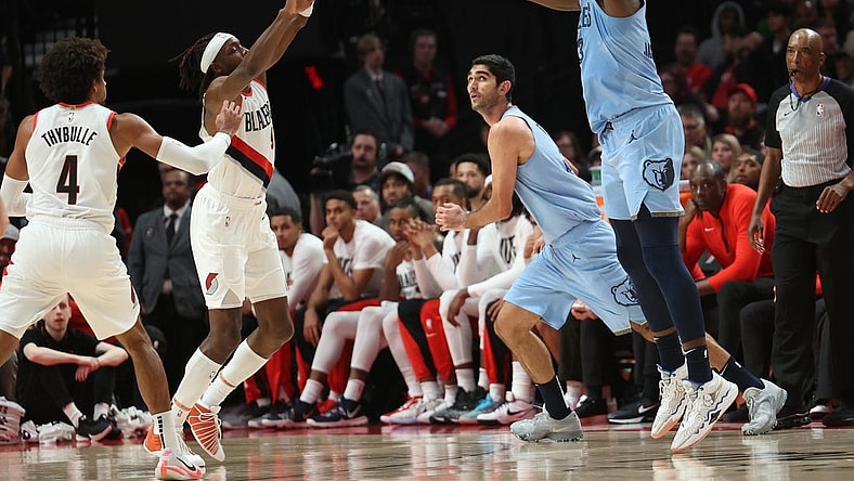 Nov 5, 2023; Portland, Oregon, USA;  Memphis Grizzlies forward Jaren Jackson Jr. (13) shoots the ball over Portland Trail Blazers forward Jerami Grant (9) at Moda Center. Mandatory Credit: Jaime Valdez-USA TODAY Sports