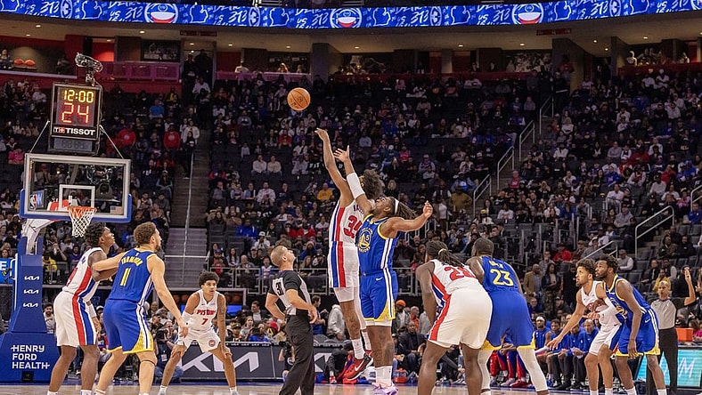 Nov 6, 2023; Detroit, Michigan, USA; Detroit Pistons forward Marvin Bagley III (35) and Golden State Warriors forward Kevon Looney (5) jump for the basketball to start the game at Little Caesars Arena. Mandatory Credit: David Reginek-USA TODAY Sports