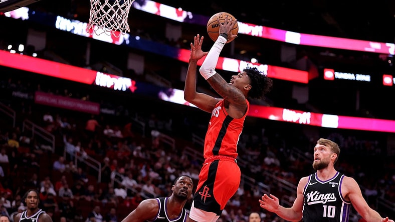 Nov 6, 2023; Houston, Texas, USA; Houston Rockets guard Jalen Green (4) makes a layup against the Sacramento Kings during the first quarter at Toyota Center. Mandatory Credit: Erik Williams-USA TODAY Sports