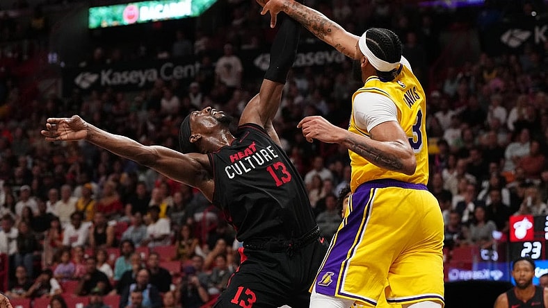 Nov 6, 2023; Miami, Florida, USA; Los Angeles Lakers forward Anthony Davis (3) fouls Miami Heat center Bam Adebayo (13) during the first half at Kaseya Center. Mandatory Credit: Jasen Vinlove-USA TODAY Sports