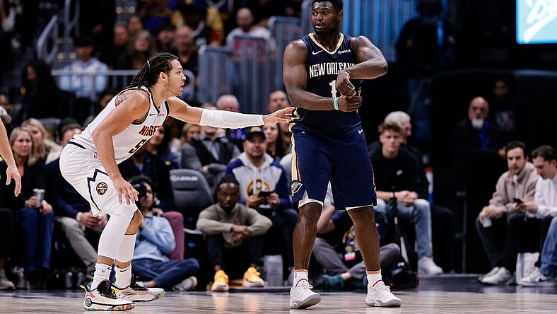 Nov 6, 2023; Denver, Colorado, USA; New Orleans Pelicans forward Zion Williamson (1) passes the ball as Denver Nuggets forward Aaron Gordon (50) guards in the fourth quarter at Ball Arena. Mandatory Credit: Isaiah J. Downing-USA TODAY Sports