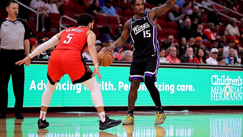 Nov 6, 2023; Houston, Texas, USA; Sacramento Kings guard Davion Mitchell (15) handles the ball against Houston Rockets guard Fred VanVleet (5) during the third quarter at Toyota Center. Mandatory Credit: Erik Williams-USA TODAY Sports