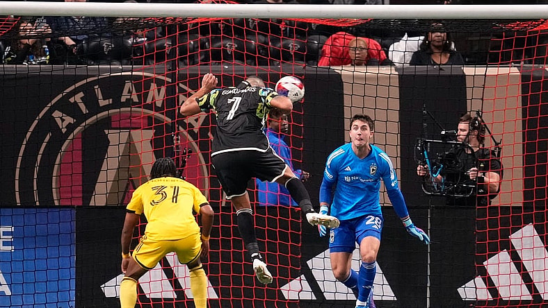 Nov 7, 2023; Atlanta, Georgia, USA; Atlanta United forward Giorgos Giakoumakis (7) scores a goal against Columbus Crew goalkeeper Diego Rossi (28) in the first half at Mercedes-Benz Stadium. Mandatory Credit: Brett Davis -USA TODAY Sports