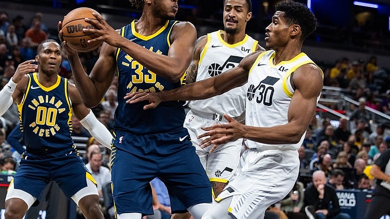 Nov 8, 2023; Indianapolis, Indiana, USA; Indiana Pacers center Myles Turner (33) rebounds the ball while Utah Jazz guard Ochai Agbaji (30) defends in the first quarter at Gainbridge Fieldhouse. Mandatory Credit: Trevor Ruszkowski-USA TODAY Sports