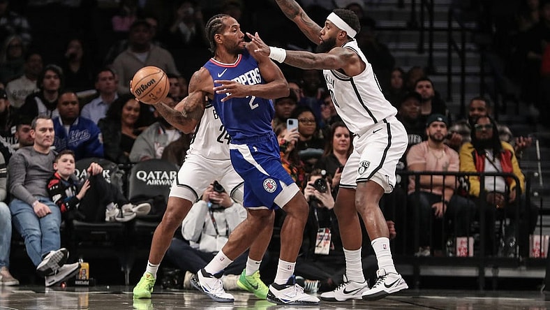 Nov 8, 2023; Brooklyn, New York, USA;  LA Clippers forward Kawhi Leonard (2) looks to make a pass while guarded by Brooklyn Nets forward Royce O'Neale (00) in the first quarter at Barclays Center. Mandatory Credit: Wendell Cruz-USA TODAY Sports