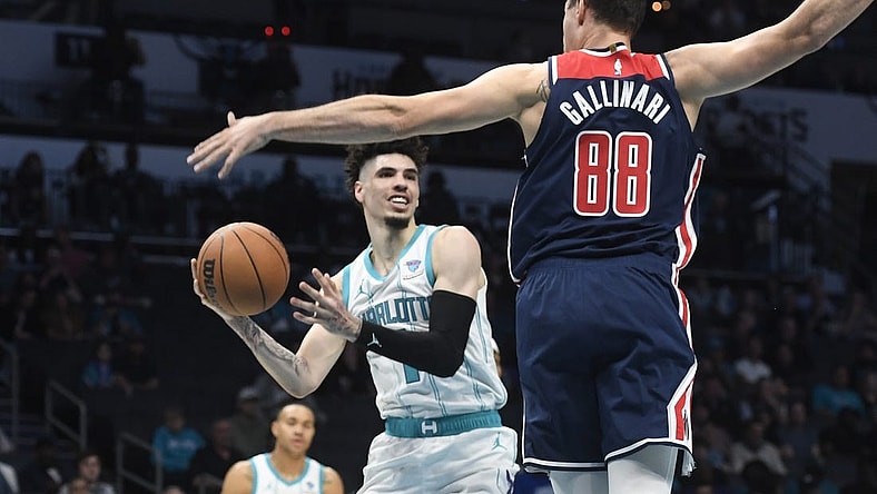 Nov 8, 2023; Charlotte, North Carolina, USA; Charlotte Hornets guard LaMelo Ball (1) looks to pass as he is defended by Washington Wizards Danilo Gallinari (88) during the first half at the Spectrum Center. Mandatory Credit: Sam Sharpe-USA TODAY Sports