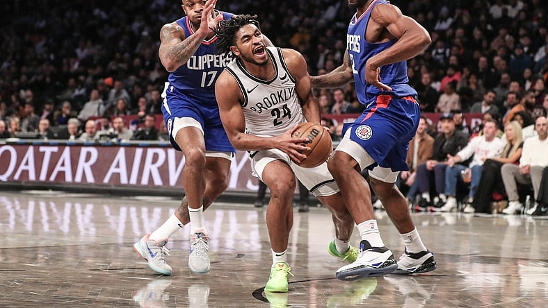 Nov 8, 2023; Brooklyn, New York, USA;  Brooklyn Nets guard Cam Thomas (24) is double teamed by LA Clippers forwards P.J. Tucker (17) and Kawhi Leonard (2) in the second quarter at Barclays Center. Mandatory Credit: Wendell Cruz-USA TODAY Sports