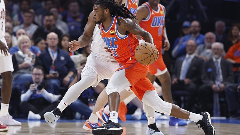 Nov 8, 2023; Oklahoma City, Oklahoma, USA; Oklahoma City Thunder guard Cason Wallace (22) drives to the basket around Cleveland Cavaliers guard Donovan Mitchell (45) during the second quarter at Paycom Center. Mandatory Credit: Alonzo Adams-USA TODAY Sports