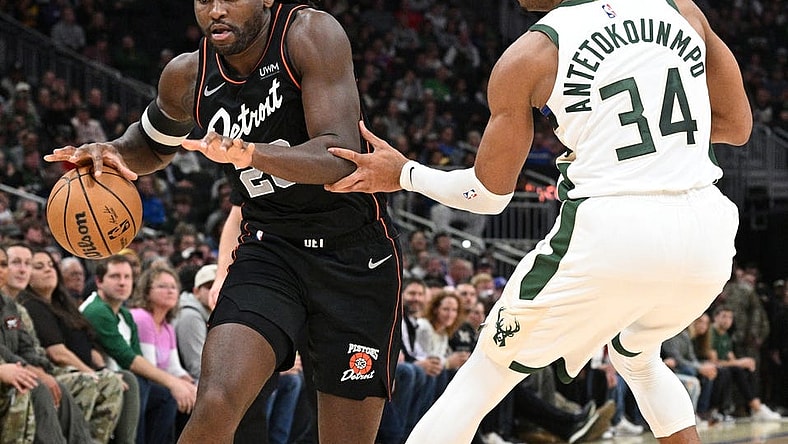Nov 8, 2023; Milwaukee, Wisconsin, USA; Detroit Pistons guard Marcus Sasser (25) drives to the basket against Milwaukee Bucks forward Giannis Antetokounmpo (34) in the first half at Fiserv Forum. Mandatory Credit: Michael McLoone-USA TODAY Sports