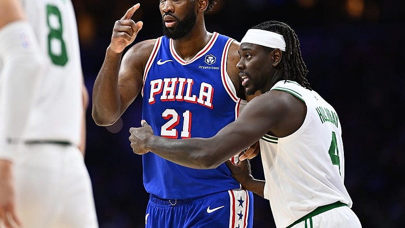Nov 8, 2023; Philadelphia, Pennsylvania, USA; Boston Celtics guard Jrue Holiday (4) defends Philadelphia 76ers center Joel Embiid (21) in the third quarter at Wells Fargo Center. Mandatory Credit: Kyle Ross-USA TODAY Sports