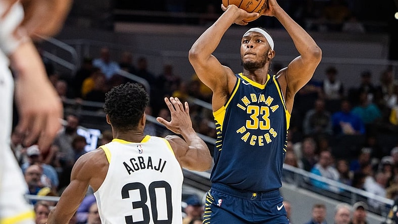 Nov 8, 2023; Indianapolis, Indiana, USA; Indiana Pacers center Myles Turner (33) shoots the ball while Utah Jazz guard Ochai Agbaji (30) defends in the second half at Gainbridge Fieldhouse. Mandatory Credit: Trevor Ruszkowski-USA TODAY Sports