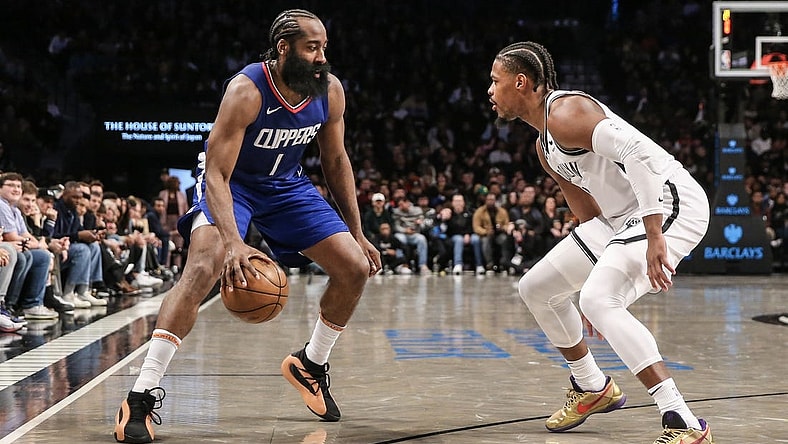 Nov 8, 2023; Brooklyn, New York, USA;  LA Clippers guard James Harden (1) looks to drive past Brooklyn Nets guard Lonnie Walker IV (8) in the third quarter at Barclays Center. Mandatory Credit: Wendell Cruz-USA TODAY Sports