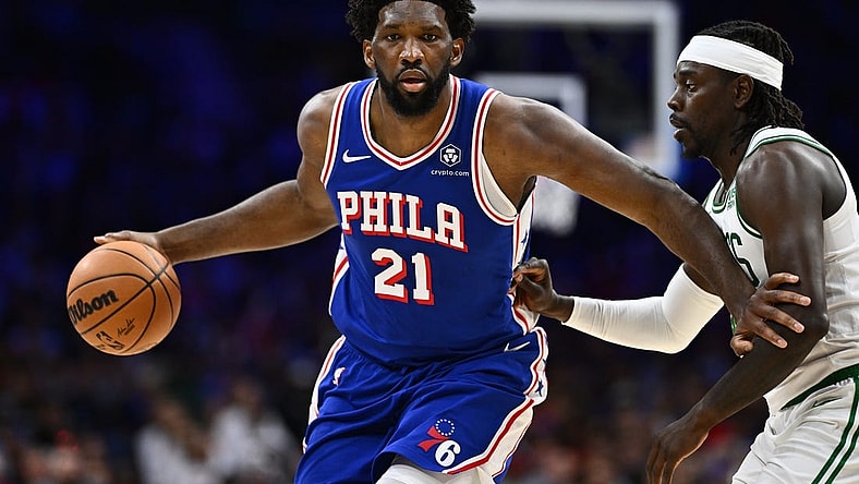 Nov 8, 2023; Philadelphia, Pennsylvania, USA; Philadelphia 76ers center Joel Embiid (21) drives against Boston Celtics guard Jrue Holiday (4) in the fourth quarter at Wells Fargo Center. Mandatory Credit: Kyle Ross-USA TODAY Sports