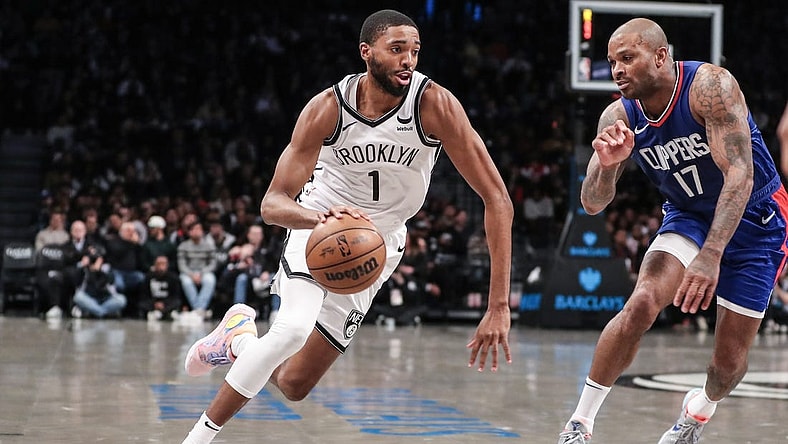 Nov 8, 2023; Brooklyn, New York, USA;  Brooklyn Nets forward Mikal Bridges (1) looks to drive past LA Clippers forward P.J. Tucker (17) in the second quarter at Barclays Center. Mandatory Credit: Wendell Cruz-USA TODAY Sports