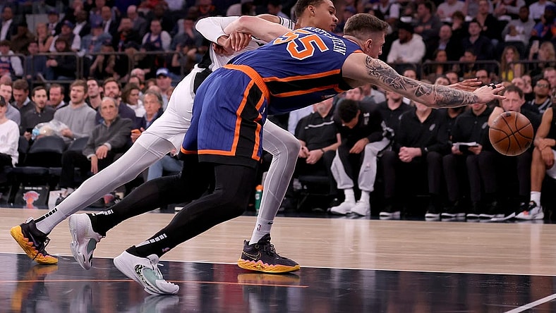 Nov 8, 2023; New York, New York, USA; San Antonio Spurs center Victor Wembanyama (1) and New York Knicks center Isaiah Hartenstein (55) fight for a loose ball during the second quarter at Madison Square Garden. Mandatory Credit: Brad Penner-USA TODAY Sports