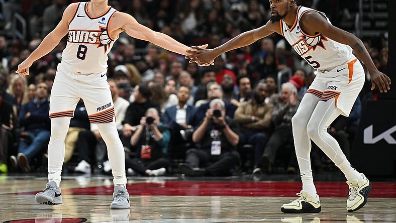 Nov 8, 2023; Chicago, Illinois, USA; Phoenix Suns forward Kevin Durant (35), right, congratulates guard Grayson Allen (8) after Allen hit a three-point shot in the second half against the Chicago Bulls at United Center. Mandatory Credit: Jamie Sabau-USA TODAY Sports
