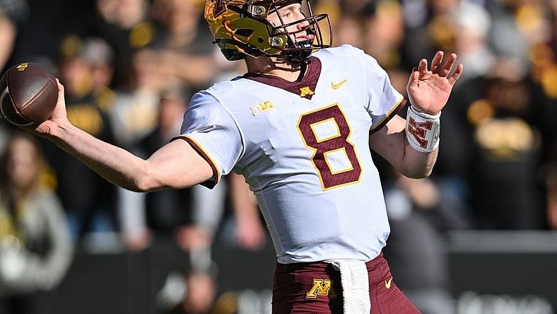 Oct 21, 2023; Iowa City, Iowa, USA; Minnesota Golden Gophers quarterback Athan Kaliakmanis (8) throws a pass against the Iowa Hawkeyes during the first quarter at Kinnick Stadium. Mandatory Credit: Jeffrey Becker-USA TODAY Sports