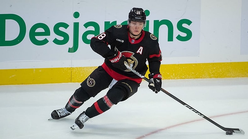 Nov 9, 2023; Ottawa, Ontario, CAN; Ottawa Senators center Tim Stutzle (18) skates with the puck in the third period against the Vancouver Canucks at the Canadian Tire Centre. Mandatory Credit: Marc DesRosiers-USA TODAY Sports