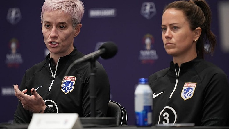 Nov 10, 2023; San Diego, California, USA; OL Reign forward Megan Rapinoe (15) speaks alongside defender Lauren Barnes (3) during a press conference at Snapdragon Stadium. Mandatory Credit: Kyle Terada-USA TODAY Sports
