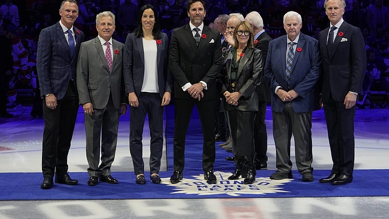 Nov 10, 2023; Toronto, Ontario, CAN; Hockey Hall of Fame Class of 2023 inductees Pierre Turgeon, Mike Vernon, Caroline Ouellette, Henrik Lundqvist, Coco Lacroix for her husband Pierre , Ken Hitchcock, and Tom Barrasso (left to right) before the start of the game between the Calgary Flames and Toronto Maple Leafs  at Scotiabank Arena. Mandatory Credit: John E. Sokolowski-USA TODAY Sports