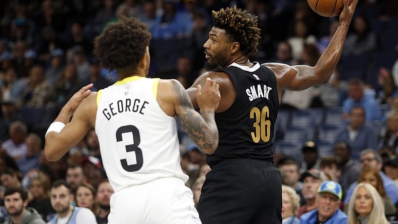 Nov 10, 2023; Memphis, Tennessee, USA; Memphis Grizzlies guard Marcus Smart (36) handles the ball as Utah Jazz guard Keyonte George (3) defends during the first half at FedExForum. Mandatory Credit: Petre Thomas-USA TODAY Sports