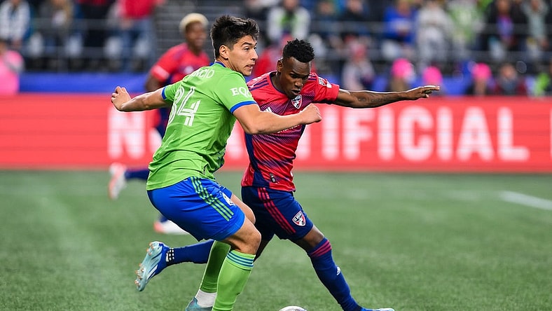 Nov 10, 2023; Seattle, Washington, USA; Seattle Sounders midfielder Josh Atencio (84) looks for a pass as FC Dallas forward J  der Obrian (8) defends during the first half at Lumen Field. Mandatory Credit: Steven Bisig-USA TODAY Sports