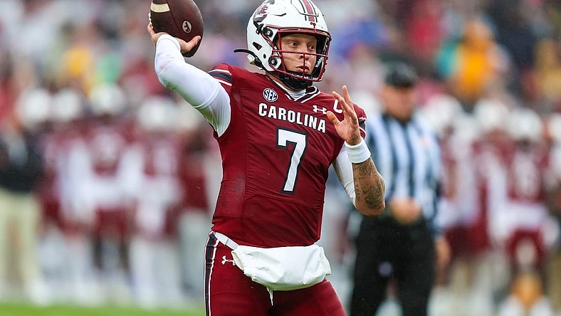 Nov 11, 2023; Columbia, South Carolina, USA; South Carolina Gamecocks quarterback Spencer Rattler (7) throws for a touchdown against the Vanderbilt Commodores in the first quarter at Williams-Brice Stadium. Mandatory Credit: Jeff Blake-USA TODAY Sports