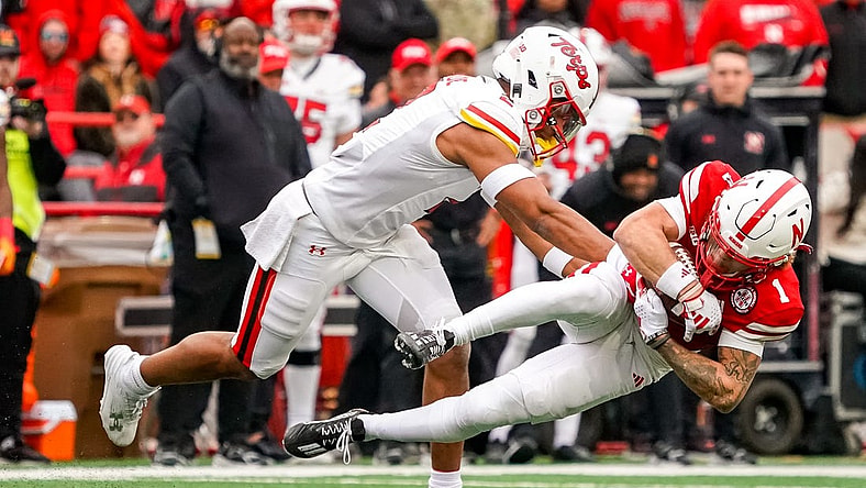 Nov 11, 2023; Lincoln, Nebraska, USA; Nebraska Cornhuskers wide receiver Billy Kemp IV (1) is brought down by Maryland Terrapins defensive back Beau Brade (2) during the second quarter at Memorial Stadium. Mandatory Credit: Dylan Widger-USA TODAY Sports