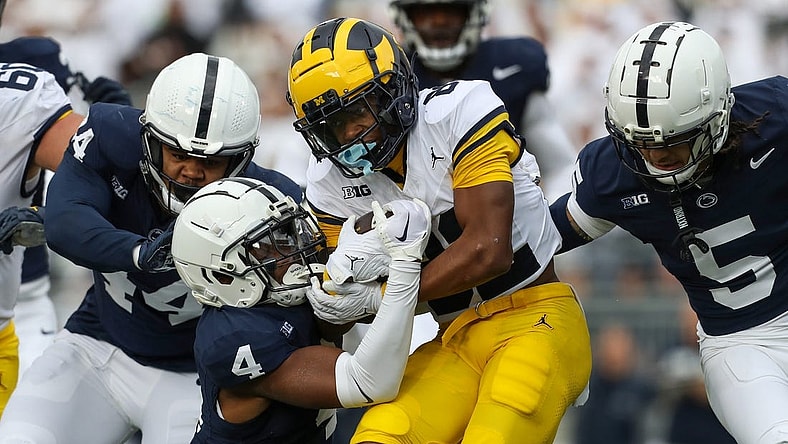 Nov 11, 2023; University Park, Pennsylvania, USA; Michigan Wolverines wide receiver Semaj Morgan (82) runs the ball against the Penn State Nittany Lions during the second quarter at Beaver Stadium. Mandatory Credit: Matthew O'Haren-USA TODAY Sports