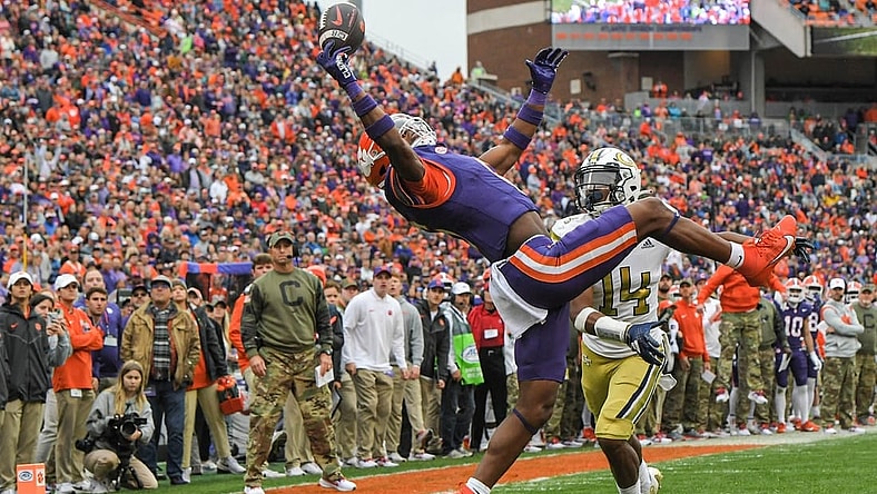 Nov 11, 2023; Clemson, South Carolina, USA; Clemson Tigers receiver Tyler Brown (6) catches a pass for a touchdown against Georgia Tech Yellow Jackets defensive back Jayloh King (14) during the second quarter  at Memorial Stadium. Mandatory Credit: Ken Ruinard-USA TODAY Sports