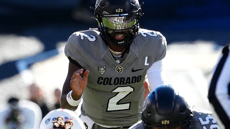 Nov 11, 2023; Boulder, Colorado, USA; Colorado Buffaloes quarterback Shedeur Sanders (2) at the line of scrimmage in the first half against the Arizona Wildcats at Folsom Field. Mandatory Credit: Ron Chenoy-USA TODAY Sports